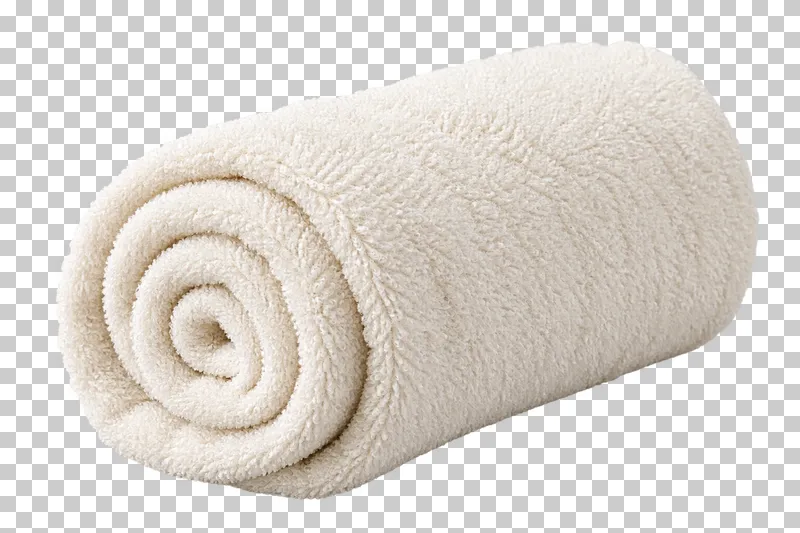 A rolled ivory terry spa towel with a loose folded end.