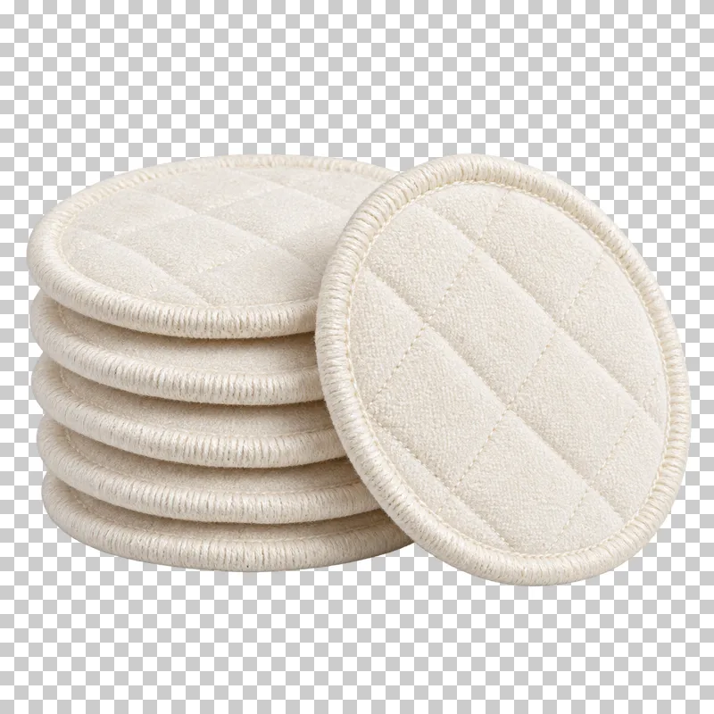 Reusable ivory cotton facial rounds with stitched edges, stacked and separated.