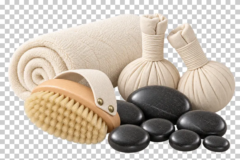 Seven massage stones, two herbal compress balls, a body brush and rolled ivory towel.