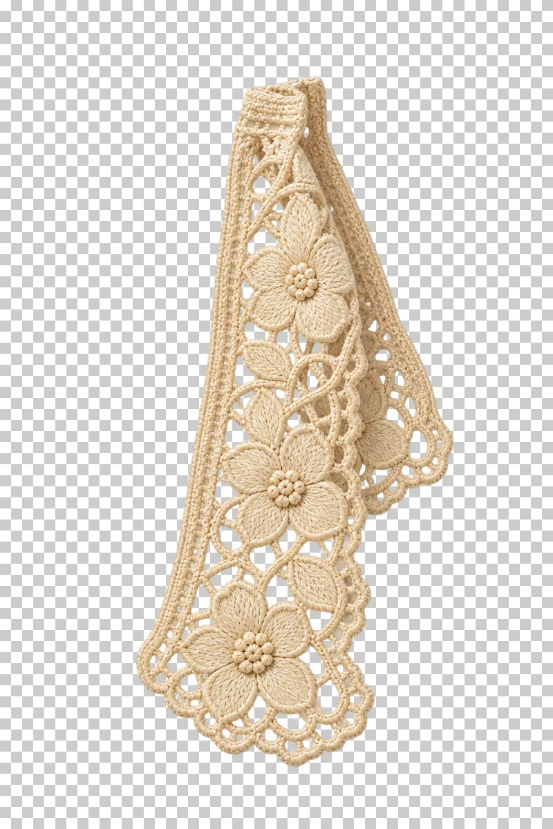 Ivory floral lace strip hanging from a folded top with a loose scalloped end.