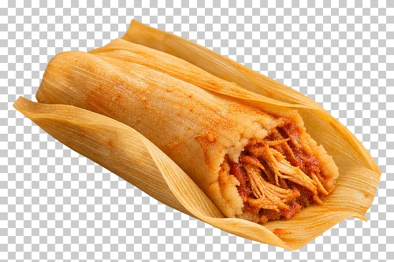 Chicken tamal in an open fibrous corn husk with a cut masa and chicken center.