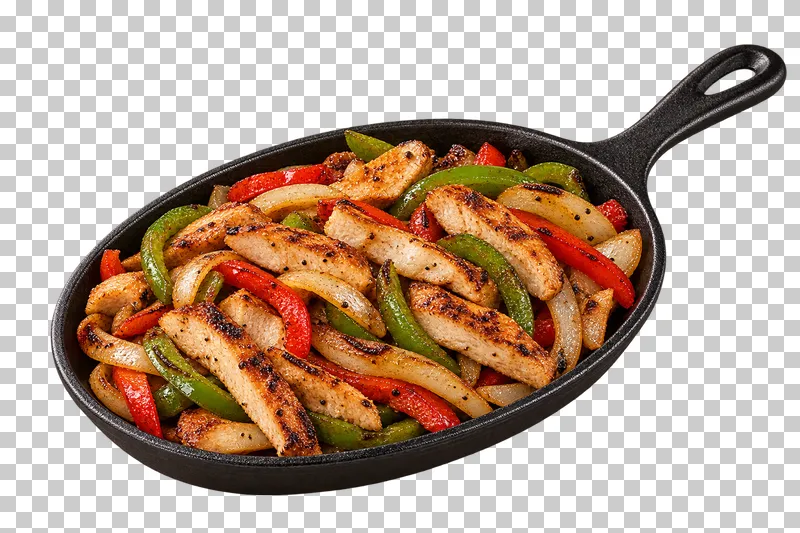 Grilled chicken, pepper and onion fajitas in a black cast-iron skillet with a full handle.