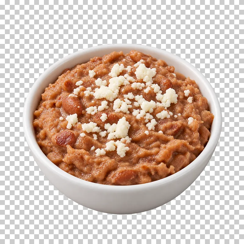 Small white bowl of rustic refried pinto beans with crumbled white cheese.