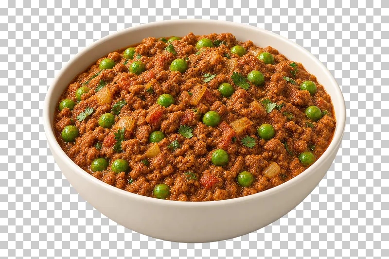 Coarsely minced cooked lamb with whole green peas, small onion pieces and very little free gravy, in a shallow ivory bowl.