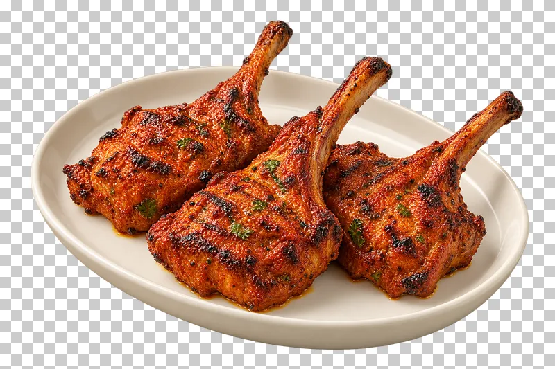 Three grilled spice-coated lamb chops with complete intact rib bones, on a plain oval ivory plate.