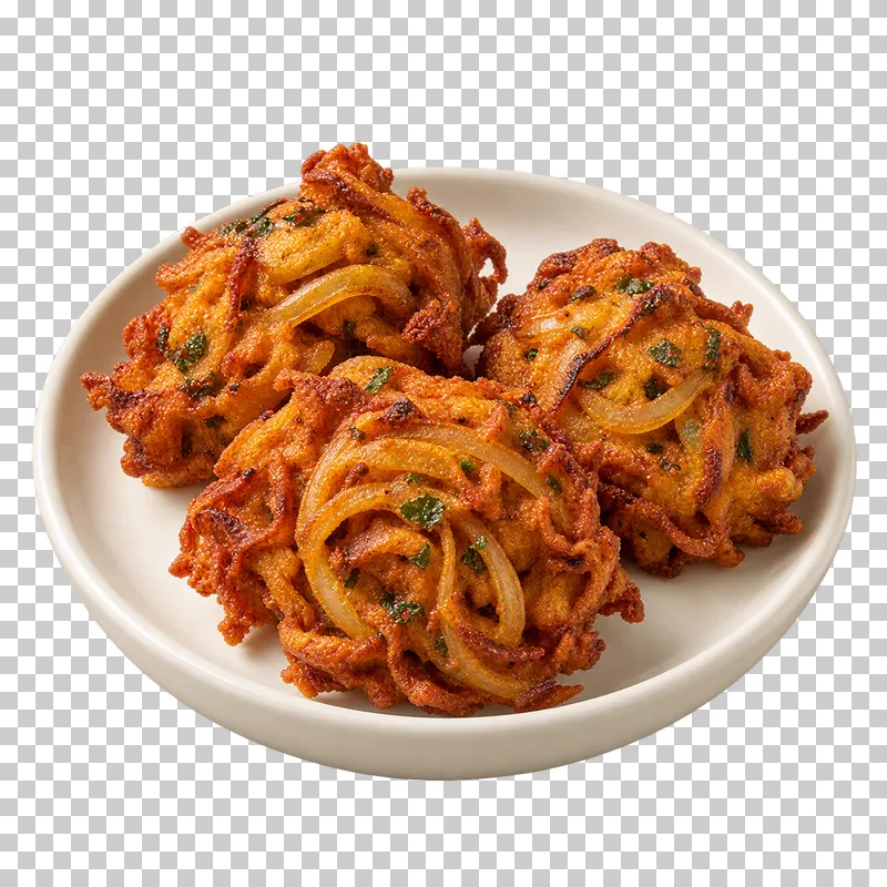Three compact irregular fried onion fritters with clearly visible intertwined onion strands, on a small round ivory plate.