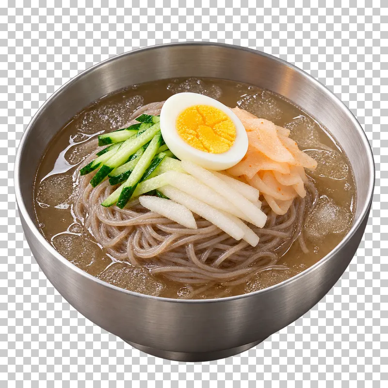 Mul-naengmyeon buckwheat noodles in clear chilled broth with cucumber, pear, radish and half a boiled egg in a steel bowl.