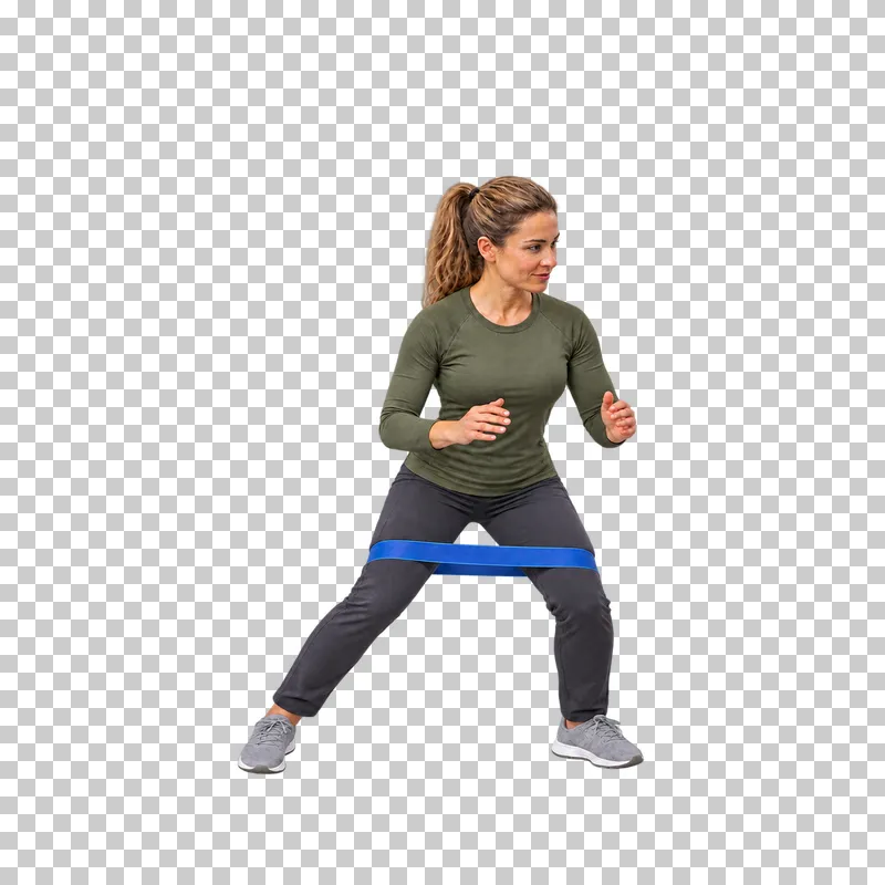 A woman taking a lateral step with a blue loop band above her knees.