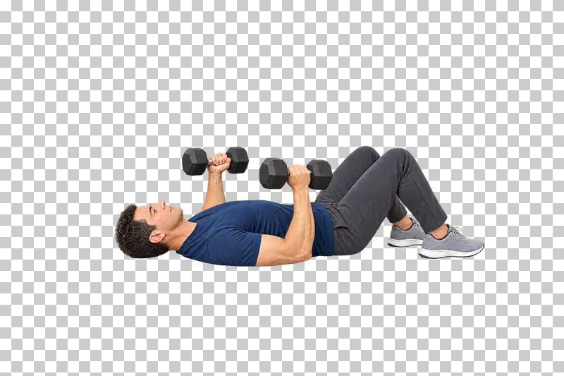 A man lying with bent knees and holding two dumbbells in a floor chest press.